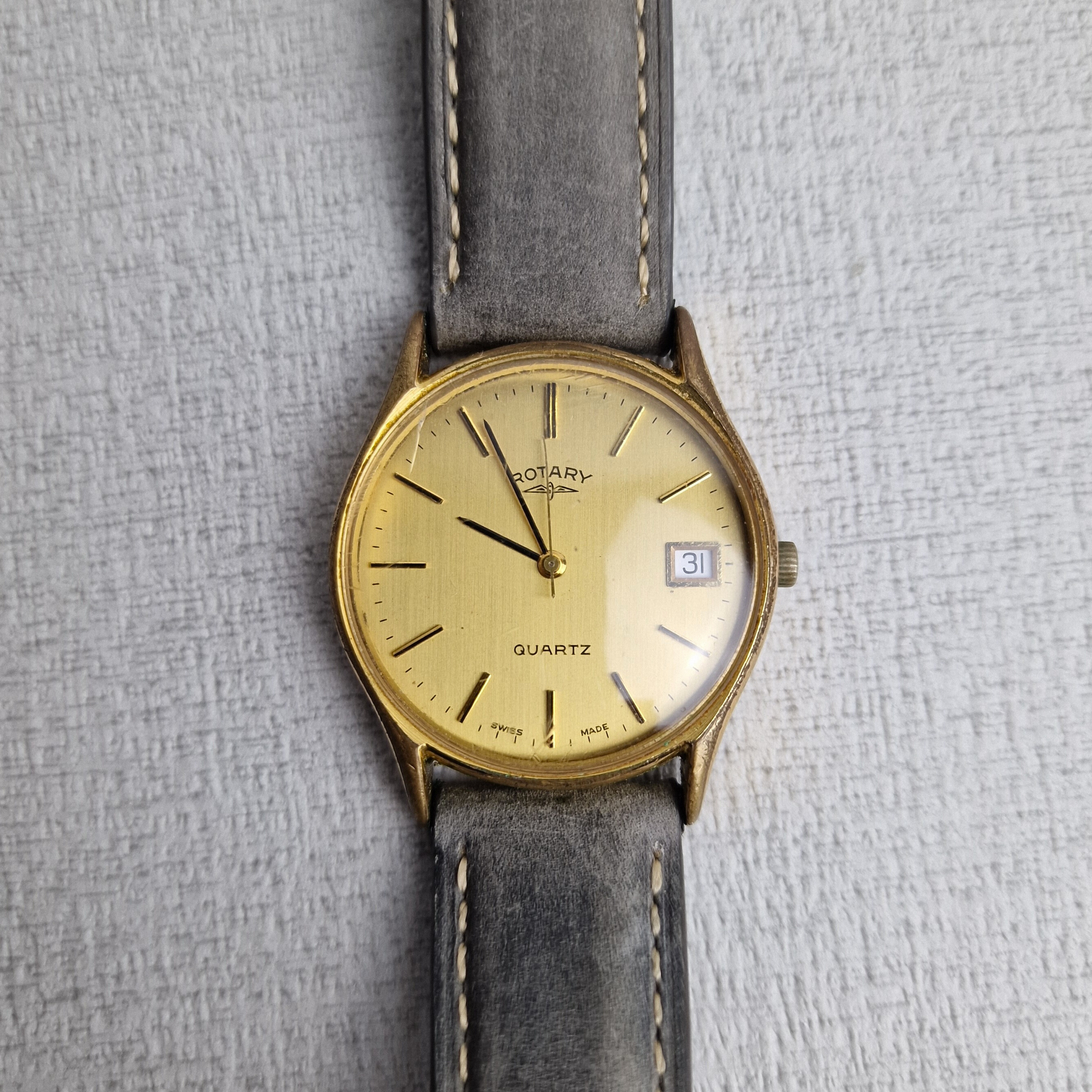 Laying Flat - Rotary Vintage Men's Watch – 32mm gold plated stainless steel Case, gold Dial, stainless steel – quartz