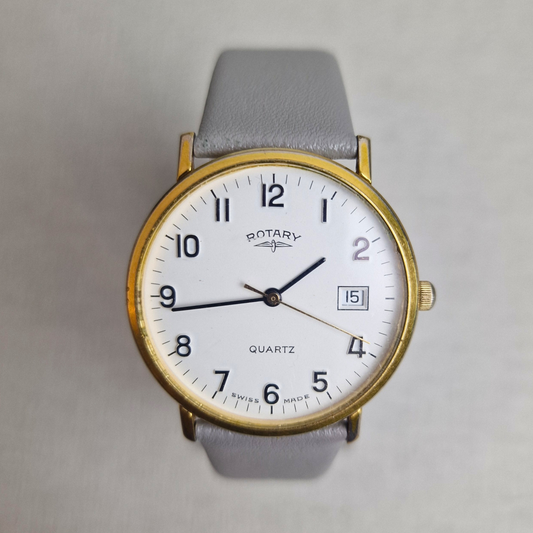 Vintage Rotary Watch Ref. 2098 with gold-plated case, white dial, date window, and leather strap. Classic 1980s quartz dress watch.