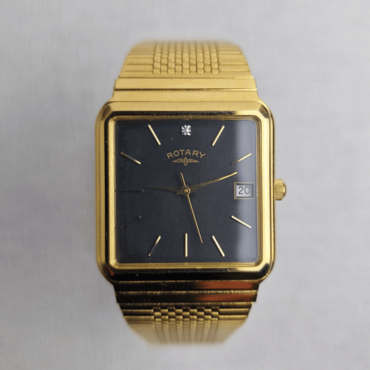 Vintage Rotary Diamond Tank Ref. 4531 featuring a 30mm gold-plated case, grey/black dial with diamond accent at 12 o'clock and date window at 3 o'clock, and integrated gold-plated bracelet.