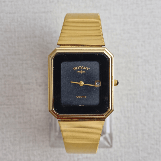 Vintage Rotary Tank "Ghost Bezel" watch Ref. 3089 with 28mm gold-plated rectangular case, black textured dial, Roman numerals, and gold-tone hands.